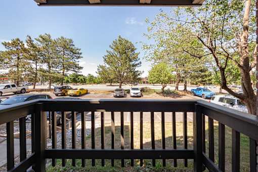 a view from a deck of cars parked in a parking lot