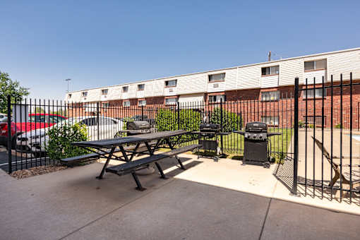 our apartments have a patio with a picnic table and grill