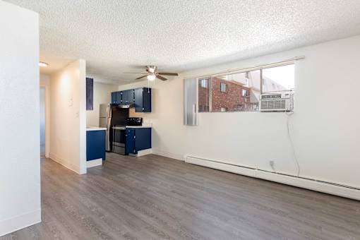 kitchen with navy cabinets and a black refrigerator