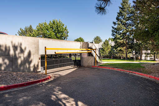the gate to the parking lot of a school is closed