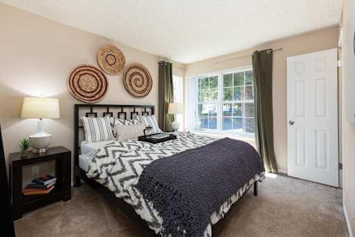 the preserve at ballantyne commons bedroom with large bed and window