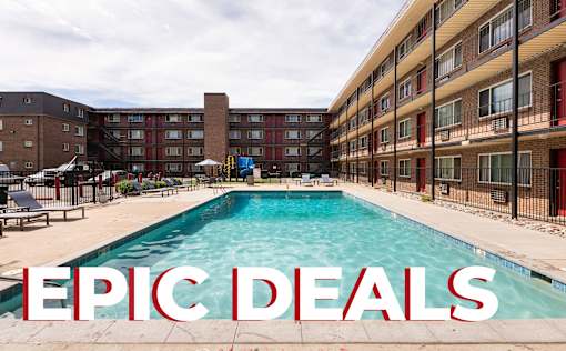 A pool in front of apartment buildings with the words "EPIC DEALS" superimposed on the image.