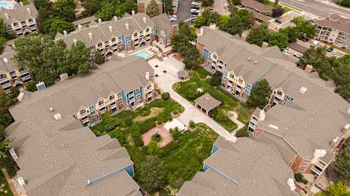 an aerial view of houses in a neighborhood with trees