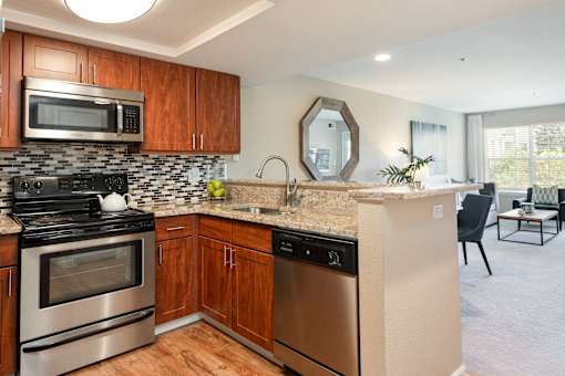 a kitchen with stainless steel appliances and a counter top