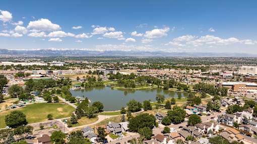 an aerial view of a lake in the middle of a city