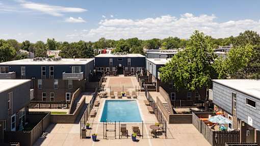 an aerial view of a pool in the middle of a building