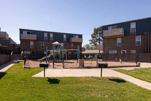 a playground in the middle of an apartment complex
