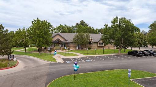a view of the front of a house with a street and parking lot