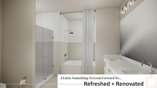 A modern bathroom with a white tub and a glass shower.