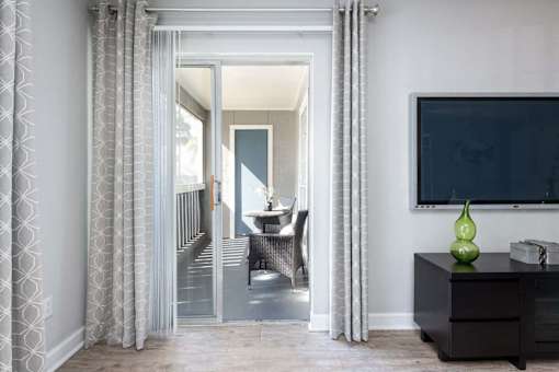 Tampa Pet Friendly Apartments at Arbour Ponds Aspen patio 2x2 950 sq fta view of the dining room from the living room of a house