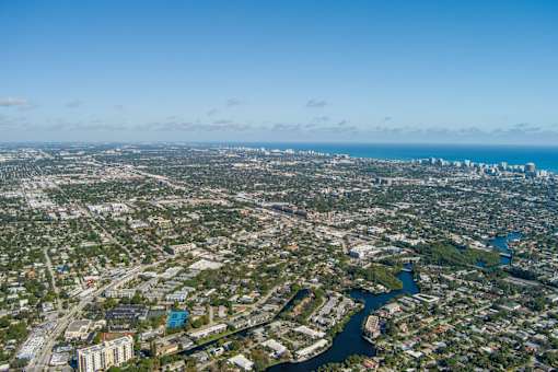an aerial view of the city and the river