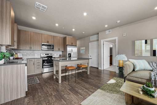 A modern kitchen with wooden cabinets and a dining table.