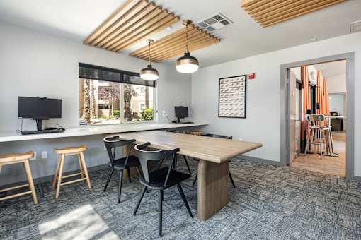 a conference room with a table and chairs and a large window