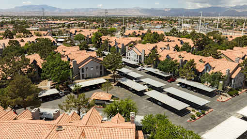 an aerial view of a suburban neighborhood with houses and cars
