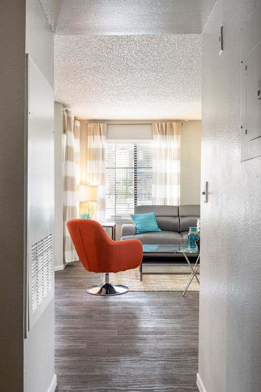 a living room with a couch and a chair