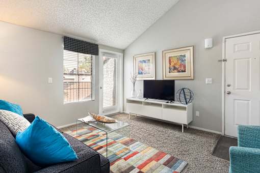 a living room with a couch and a tv