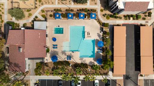 arial view of a house with a swimming pool in the middle of it