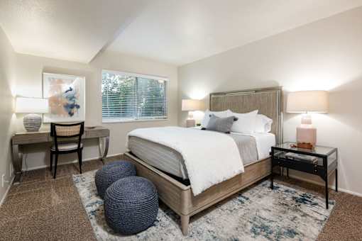a bedroom with a bed and a round window
