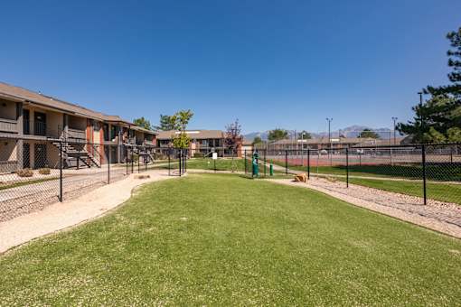 our apartments have a fenced in yard with grass