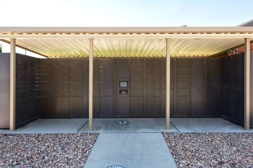 the outside of a building with a covered area and a door