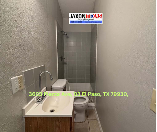 A bathroom with a sink, toilet and shower.