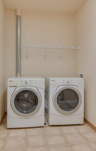 Two white front loading washing machines in a laundry room, Kassenborg Apartments, Moorhead, MN, 56560
