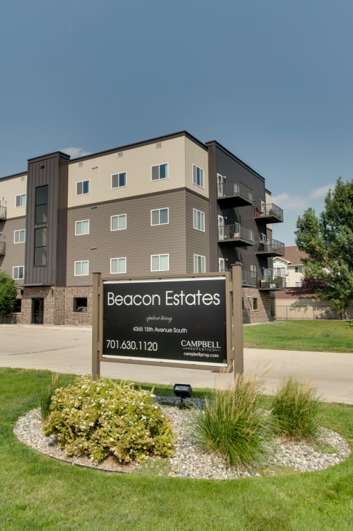 a building with a sign that says beacon estates at Beacon Estates Apartments, Fargo, ND, 58103