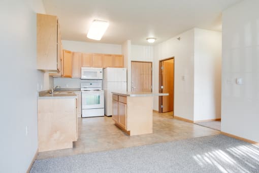 Kitchen with white appliances at Lakestone Apartments, Moorhead, MN