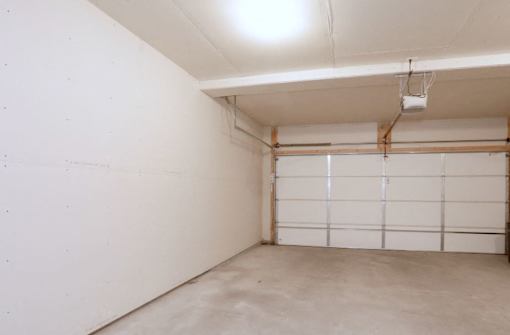 A white garage door is closed.