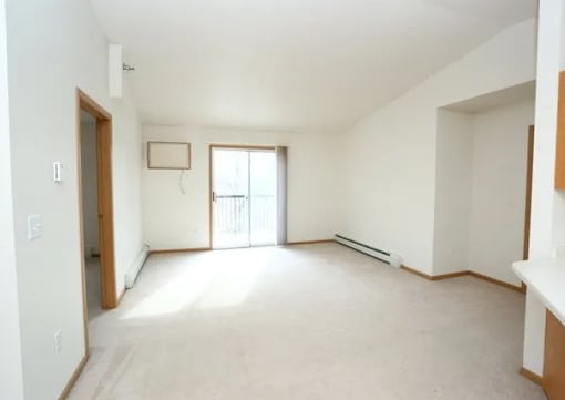 A room with a window and a door.
