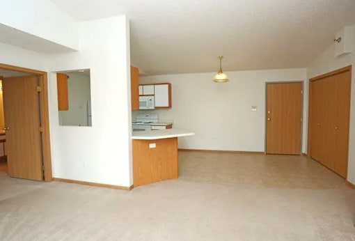 A room with a desk and a cabinet.