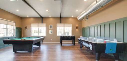 a game room with two pool tables and two air hockey tables, Pinehurst Apartments, Baxter, 56425