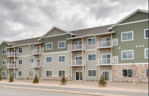 an apartment building on the side of a street, Pinehurst Apartments, Baxter
