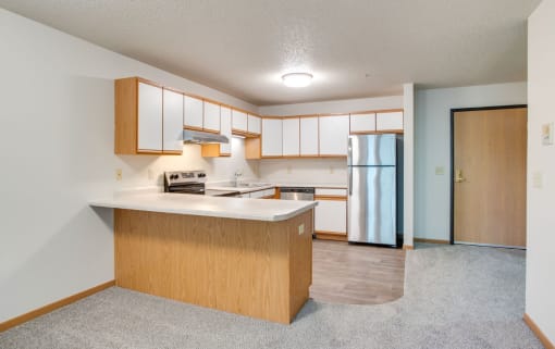 Kitchen with stainless steel appliances at Redwood Estates, Coon Rapids, Minnesota, 55433
