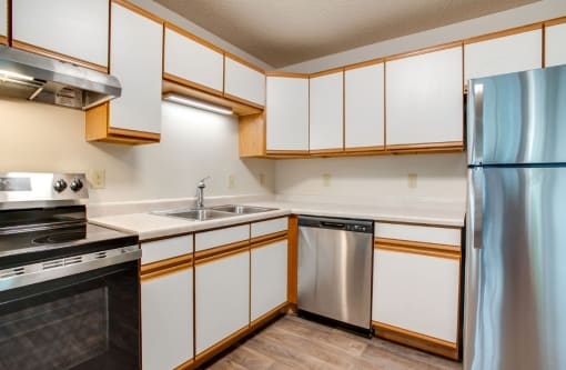 Kitchen with stainless steel appliances at Redwood Estates, Coon Rapids, Minnesota, 55433