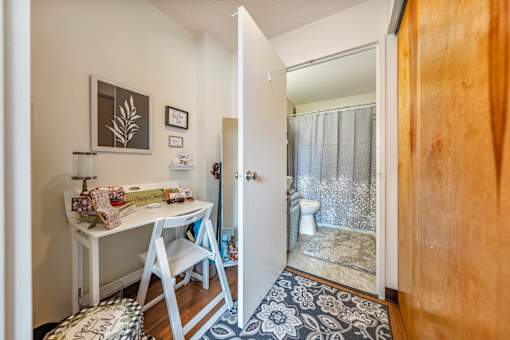 A small room with a desk and chair.