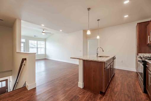 A kitchen with wooden floors and a countertop.