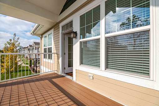 A patio with a door and a window.