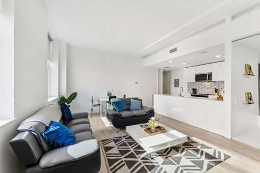 A modern living room with a black and white color scheme.