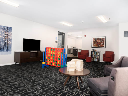 a living room filled with furniture and a tv