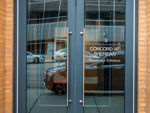 the entrance to the concord with cars reflected in
