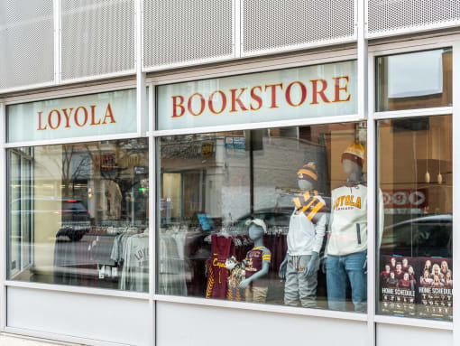 a window display of a bookstore with mannequins in the window