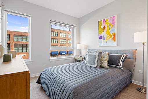 Bedroom With Expansive Windows at 23rd Place Apartments, Chicago, 60616