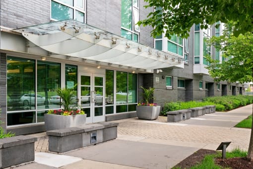 A building with a glass facade and a white awning.