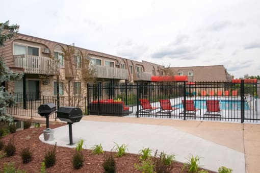 Private apartment grilling area near pool deck and lounge area. 