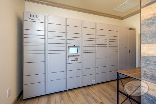 A mail center with lockers, a table, and Amazon Hub.