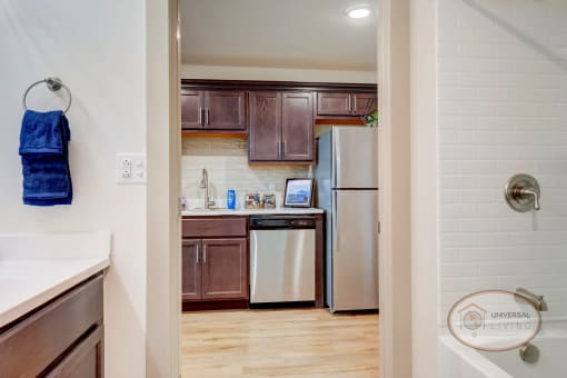 A view of the kitchen from the bathroom across the hallway.