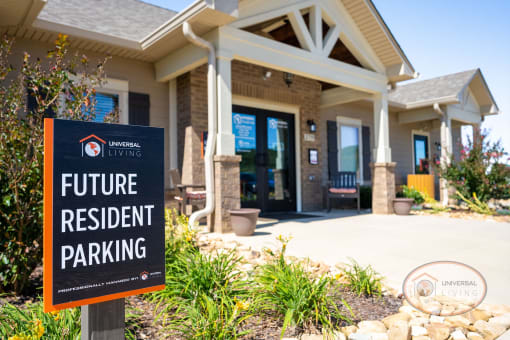 A sign that reads "future resident parking" in front of the clubhouse.