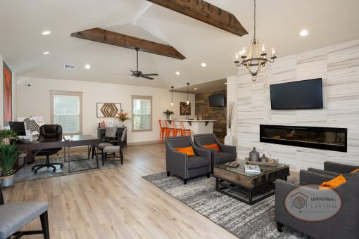 The clubhouse lounge with flat screen TV, fireplace, coffee bar, and office.