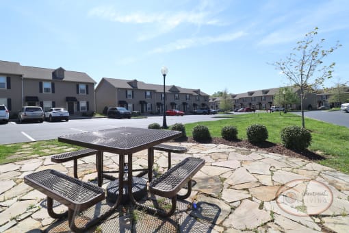 A picnic area with table for outdoor gathering.